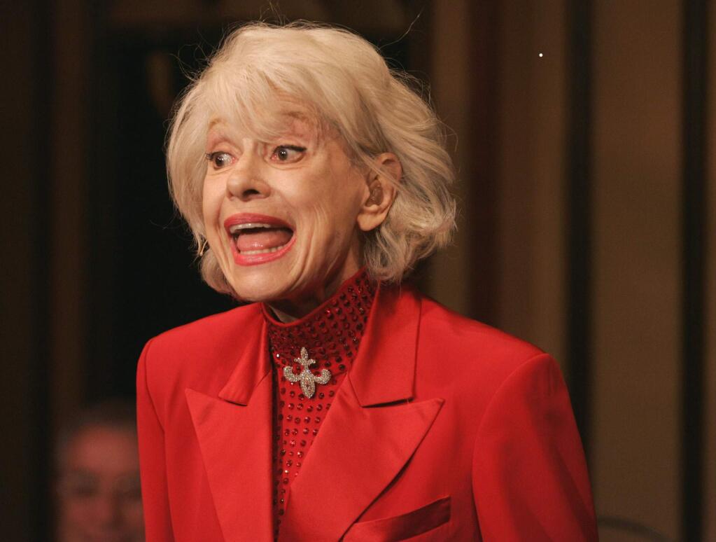 FILE - In this Oct. 18, 2005 file photo, Carol Channing performs during her one woman show,'The First 80 Years are the Hardest,' at the cabaret Feinstein's at the Regency in New York. Channing, whose career spanned decades on Broadway and on television has died at age 97. Publicist B. Harlan Boll says Channing died of natural causes early Tuesday, Jan. 15, 2019 in Rancho Mirage, Calif. (AP Photo/Richard Drew)