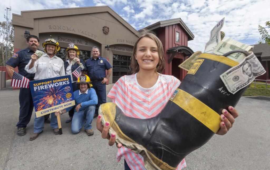 In front of the Sonoma Valley Fire Department on Second St. West, 10-year old Lia Jerry holds a fireman's boot to accept fireworks donations. Behind her (from left) Captain Tom Deely, president, Sonoma Volunteer Firefighters Association; Jon Parker, president-elect Rotary Club of Sonoma Valley; Susan Hoeffel, president, Rotary Club of Sonoma Valley; Fire Chief Mark Freeman. (Photo by Robbi Pengelly/Index-Tribune)
