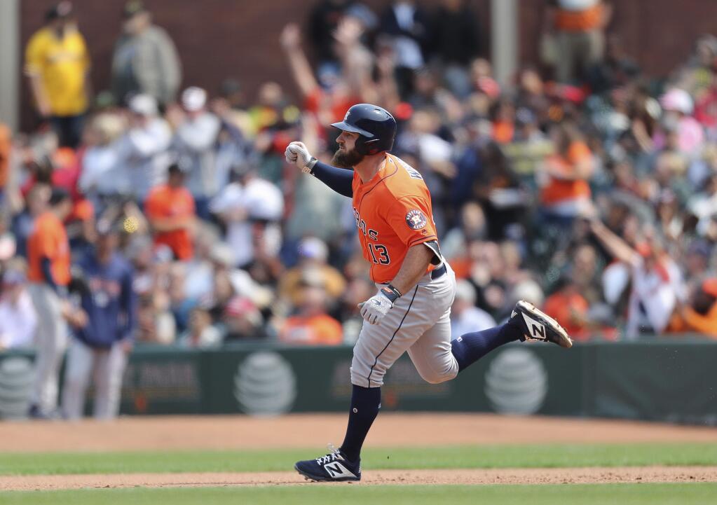 The Houston Astros' Tyler White rounds the bases after hitting a two-run home run against the San Francisco Giants during the eighth inning in San Francisco, Tuesday, Aug. 7, 2018. (AP Photo/Scot Tucker)