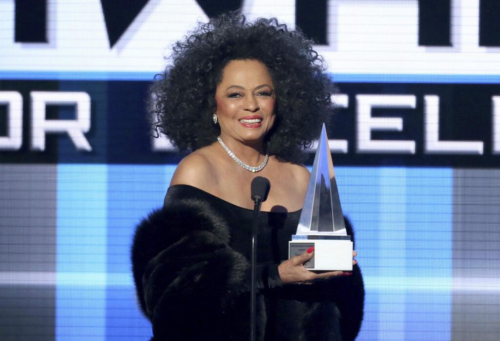 FILE - In this Nov. 23, 2014, file photo, Diana Ross presents the Dick Clark award for excellence at the 42nd annual American Music Awards. ABC and Dick Clark Productions announced on Oct. 18, 2017, that Ross would receive a lifetime achievement honor and perform at the upcoming ceremony on Nov. 19. (Photo by Matt Sayles/Invision/AP, File)