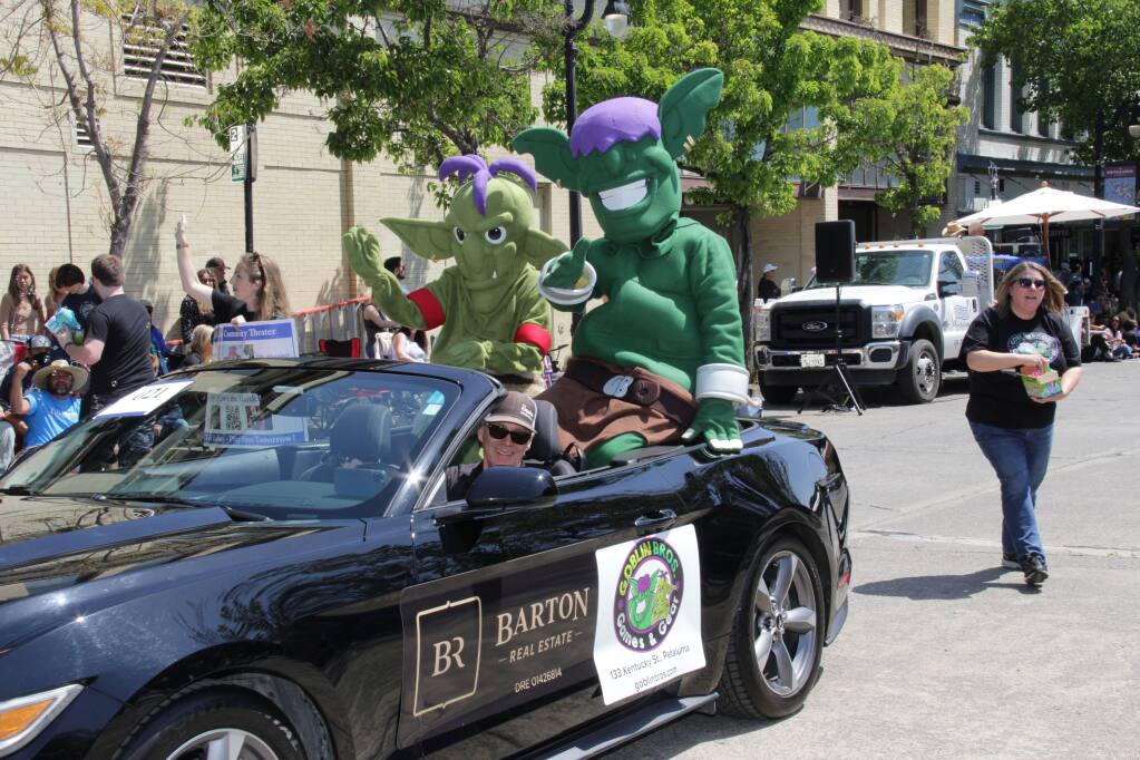 Goblin Bros. mascots Gryn and Grump ride in the Butter & Egg Parade. (JIM JOHNSON)