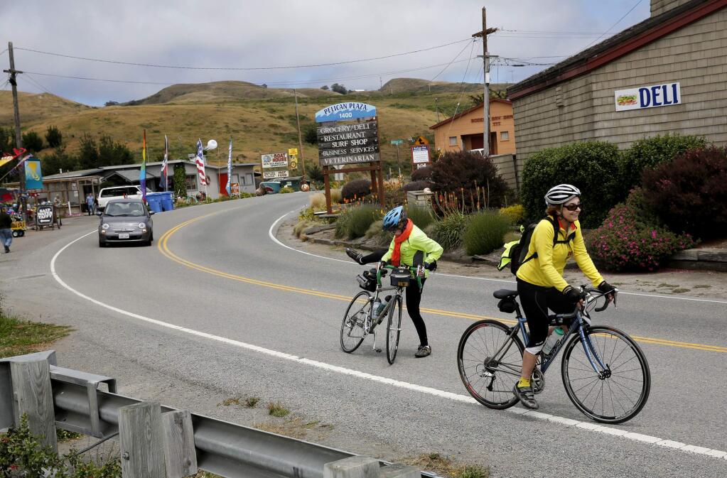 Cyclists stop for a moment along Highway 1 in Bodega Bay on Wednesday, June 5, 2013. (BETH SCHLANKER/ PD)
