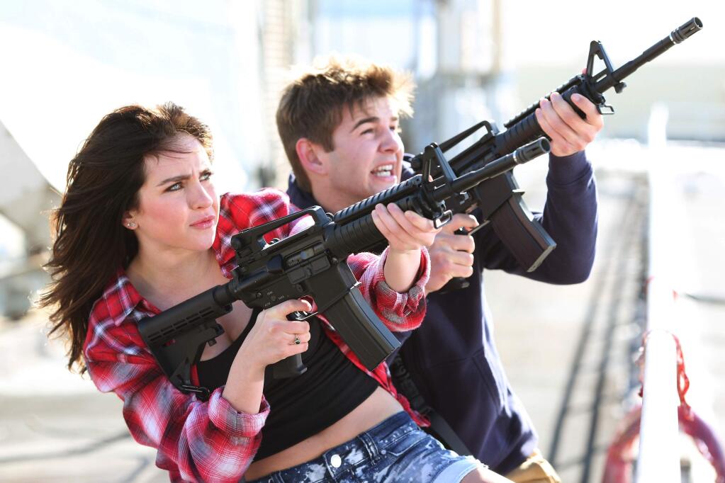In this image released by Syfy, Ryan Newman as Claudia Shepard, left, and Jack Griffo as Billy appear in a scene from 'Sharknado 3: Oh Hell No!' premiering on Wednesday, at 9 p.m. EDT on Syfy. (Raymond Liu/Syfy via AP)