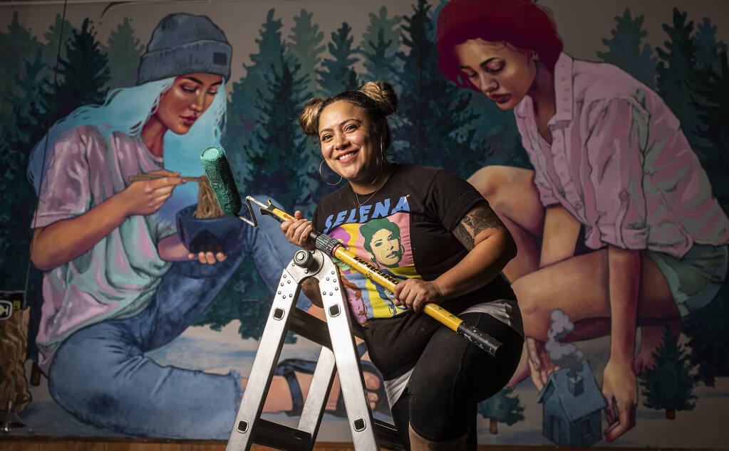 Artist MJ Lindo-Lawyer painted a mural in front of Cooperage Brewery in Santa Rosa in this file photo. Her organization, The Mural Project, Inc., is one of the grant recipients Corazón Healdsburg and the Art and Culture Collective of Northern Sonoma County. (John Burgess / The Press Democrat)