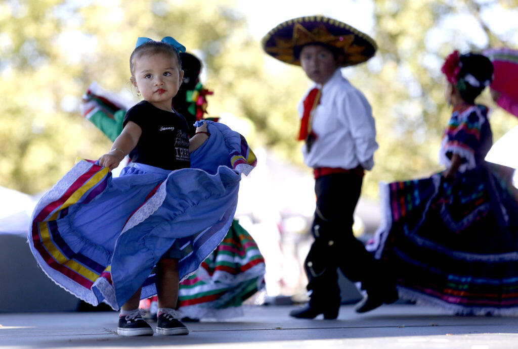 Janney Olmedo, 1, performs with the group Ballet Folklorico Ireri Petaluma during the Fiesta de Independencia at the Luther Burbank Center for the Arts in Santa Rosa on Sunday, September 16, 2018. (Beth Schlanker/ The Press Democrat)