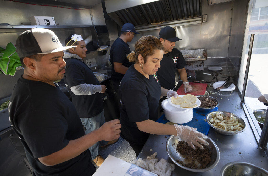 Rohnert Park restaurant Taqueria el Paisa passed out free tacos for evacuees, volunteers and anyone who was hungry at the Red Cross shelter at the Sonoma County Fairgrounds on Sunday.  (photo by John Burgess/The Press Democrat)