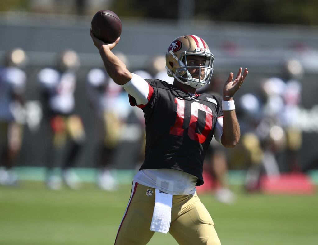 San Francisco 49ers quarterback Jimmy Garoppolo passes during practice at the team's headquarters Thursday, Aug. 2, 2018, in Santa Clara. (AP Photo/Ben Margot)