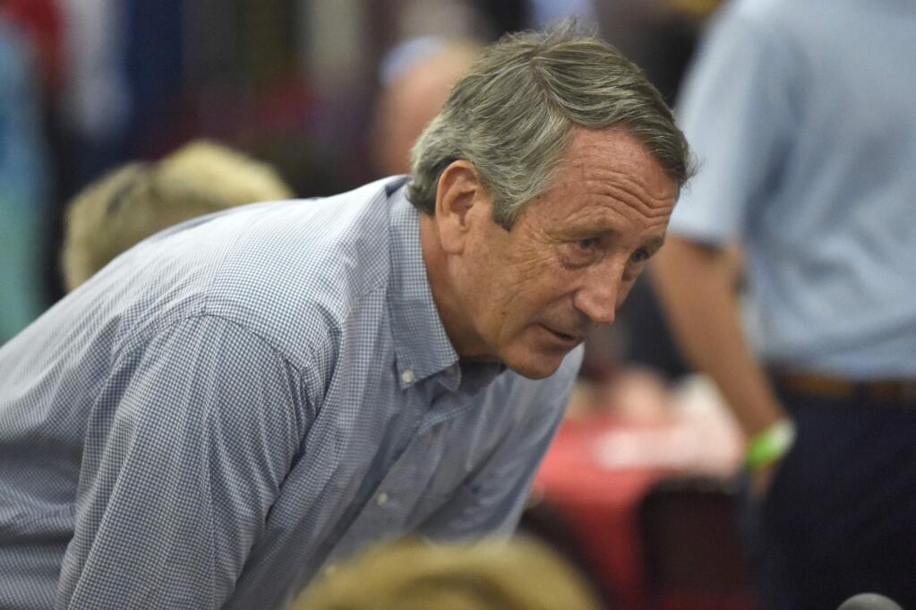 FILE - In this Aug. 26, 2019, file photo, former Rep. Mark Sanford speaks with attendees at Rep. Jeff Duncan's annual fundraiser in Anderson, S.C. Sanford is considering a challenge to President Donald Trump, and while he's acknowledging he faces long odds, he also says he's survived long odds in his past political career. (AP Photo/Meg Kinnard)