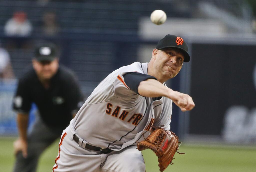 San Francisco Giants starting pitcher Tim Hudson throws against the San Diego Padres in the first inning of a baseball game Monday, July 20, 2015, in San Diego. (AP Photo/Lenny Ignelzi)