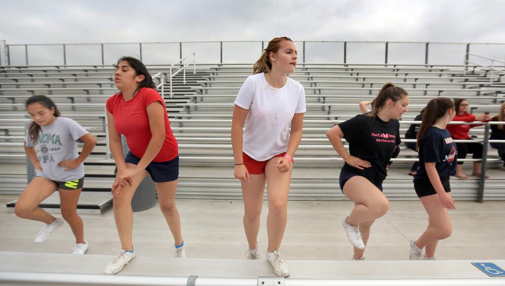 Cheerleaders (from left) Ivette Martinez, Guadalupe Alvarez, Megan Gamel, Sarah Fox and Sammie Ramirez get in shape for practice at Rancho Cotate High School in Rohnert Park on Tuesday, May 26, 2015. (KENT PORTER/ PD FILE)