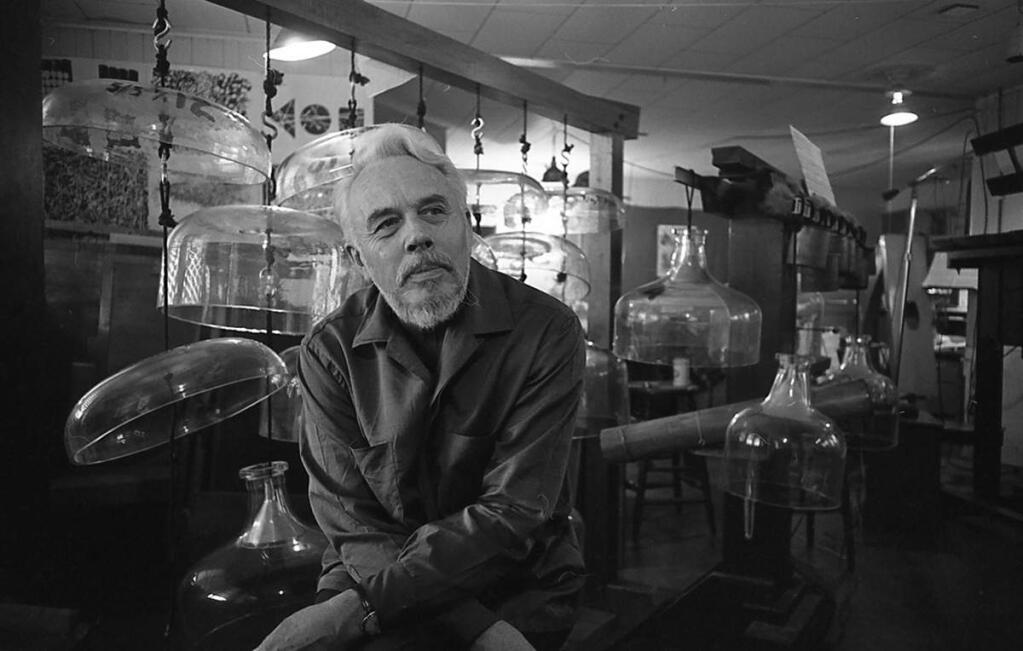 Harry Partch with his Cloud-Chamber Bowls and Spoils of War instruments in his Petaluma studio in 1964. (Bruce Harlow)