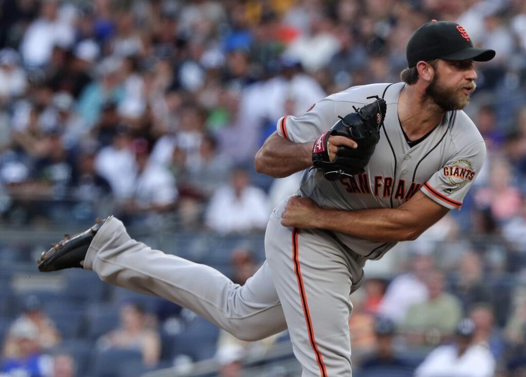 San Francisco Giants starter Madison Bumgarner follows through on a pitch to the New York Yankees during the first inning of a baseball game, Friday, July 22, 2016, in New York. (AP Photo/Julie Jacobson)