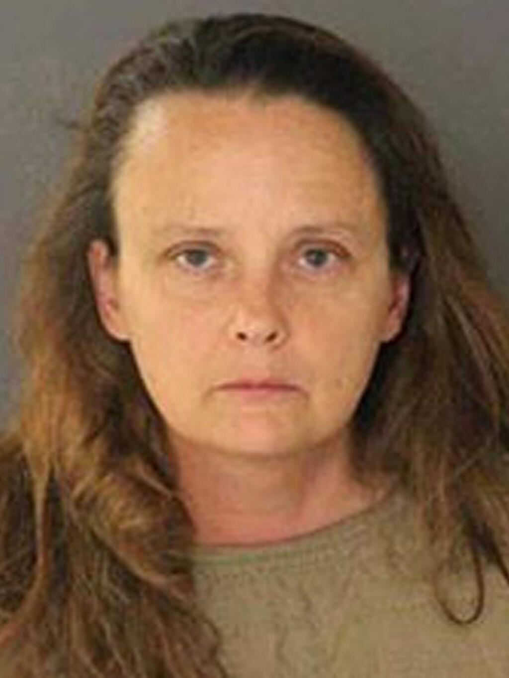 This photo released Thursday, Aug. 3, 2017, by San Jose Police Department shows suspect Gail Burnworth, a resident of Tacoma, Wash., who was one of two people arrested after a sharp-eyed airline passenger saw another traveler texting about sexually assaulting children. San Jose police say they arrested 56-year-old Michael Kellar in the city's airport Monday night after a flight from Seattle. Officers arrested 50-year-old Gail Burnworth in her Tacoma home. (San Jose Police Department via AP)
