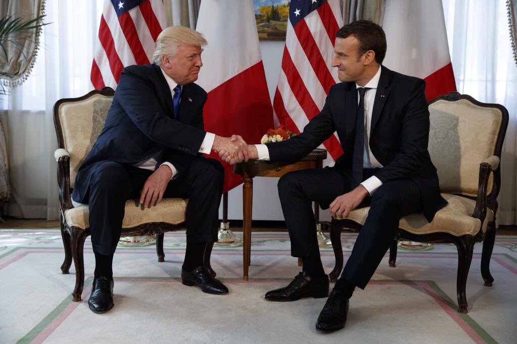 President Donald Trump shakes hands with French President Emmanuel Macron during a meeting at the U.S. Embassy, Thursday, May 25, 2017, in Brussels. (AP Photo/Evan Vucci)