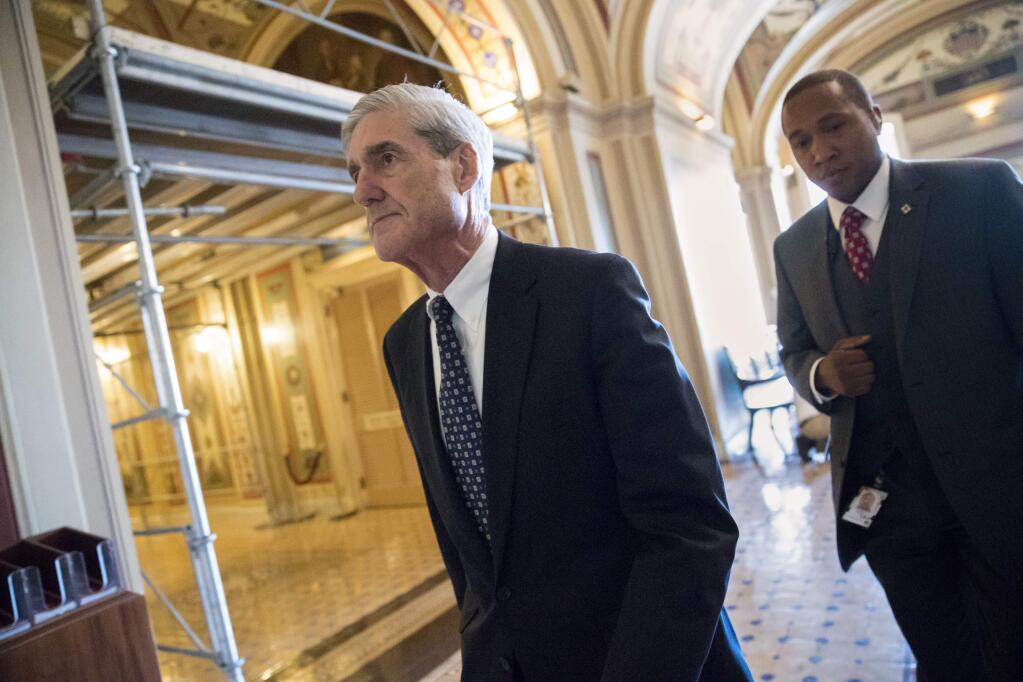 FILE - In this June 21, 2017 file photo, special counsel Robert Mueller departs after a closed-door meeting with members of the Senate Judiciary Committee about Russian meddling in the election and possible connection to the Trump campaign, at the Capitol in Washington. President Donald Trump's legal team is evaluating potential conflicts of interest among members of Mueller's investigative team, according to three people with knowledge of the matter. The revelations come as Mueller's probe into Russia's election meddling appears likely to include some of the Trump family's business ties. (AP Photo/J. Scott Applewhite, File)