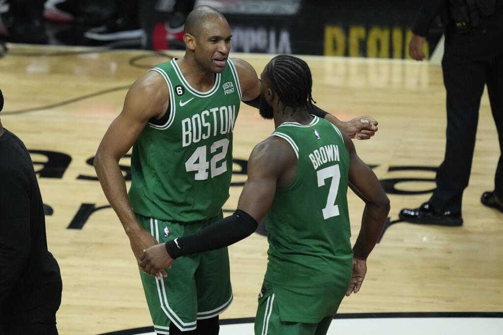 Boston Celtics center Al Horford and forward Jaylen Brown celebrate after beating the Heat 104-103 during Game 6 of the Eastern Conference finals, Saturday, May 27, 2023, in Miami. (Rebecca Blackwell / ASSOCIATED PRESS)
