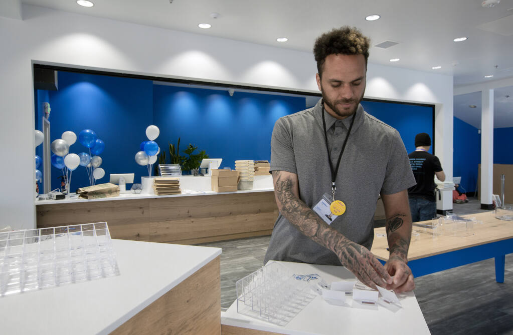 Supervisor Damien Smith prepares labels for product at the SPARC cannabis dispensary on Highway 12 on Monday, April 18, 2022. The facility will open on Wednesday, April 20. (Robbi Pengelly/Index-Tribune)