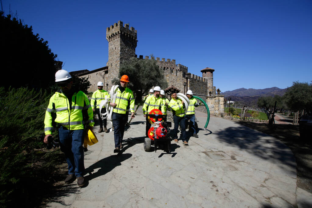 After the 2020 Glass fire destruction of the Farmhouse wine warehouse on the property, Castello di Amorosa winery near Calistoga in early 2021 formed a fire brigade to prepare the property for high fire danger and help stage the hoses and water resources firefighters need to battle resulting blazes. The team, seen near the winery castle on March 11, 2021, is called Cavalieri del Fuoco, which means the "Knights of Fire" in Italian. (Castello di Amorosa)