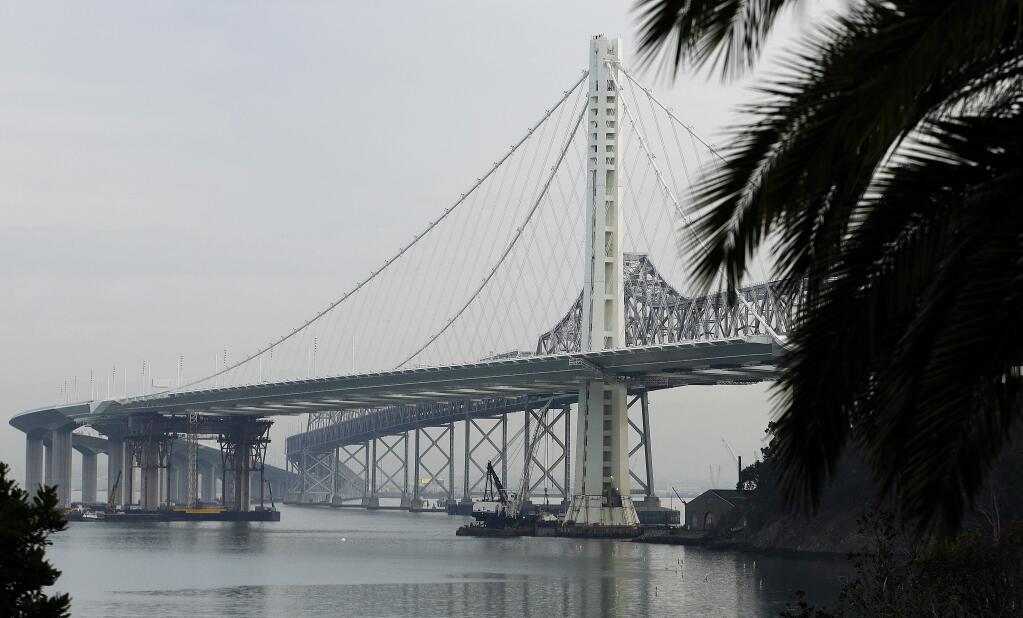 In this Jan. 7, 2014, file photo, work continues on the new eastern span of the San Francisco Oakland Bay Bridge in San Francisco. (AP Photo/Ben Margot, File)