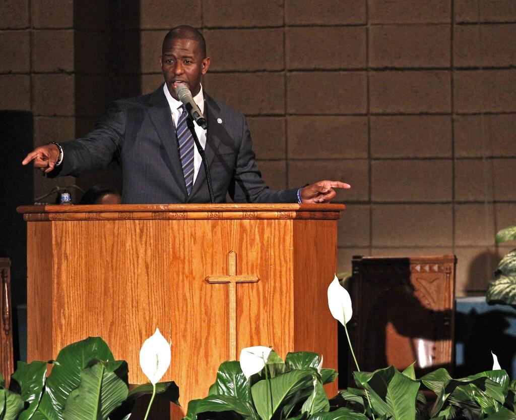Mayor Andrew Gillum addresses supporters and urges that they keep politically engaged as the Broward County of Supervisor of Elections Office have five days to recount cast votes over an entire month leading up to Tuesday's midterm election. Gillum held a faith-based recount rally inside New Mount Olive Baptist Church in Fort Lauderdale, Fla., on Sunday, Nov. 11, 2018. (Carl Juste/Miami Herald via AP)