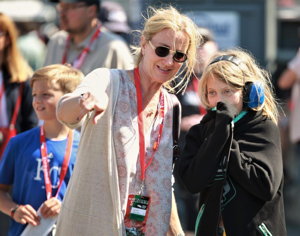 A mother and daughter explore the garage and pit area prior to Sunday's IndyCar season finale at Sonoma Raceway, September 17th, 2017. The reigning 2016 IndyCar series Champion, Simon Pagenaud won the race at Sonoma Raceway and Josef Newgarden won the 2017 series championship with his 2nd place finish behind Pagenaud to close out the season. (Will Bucquoy / For the Press Democrat)