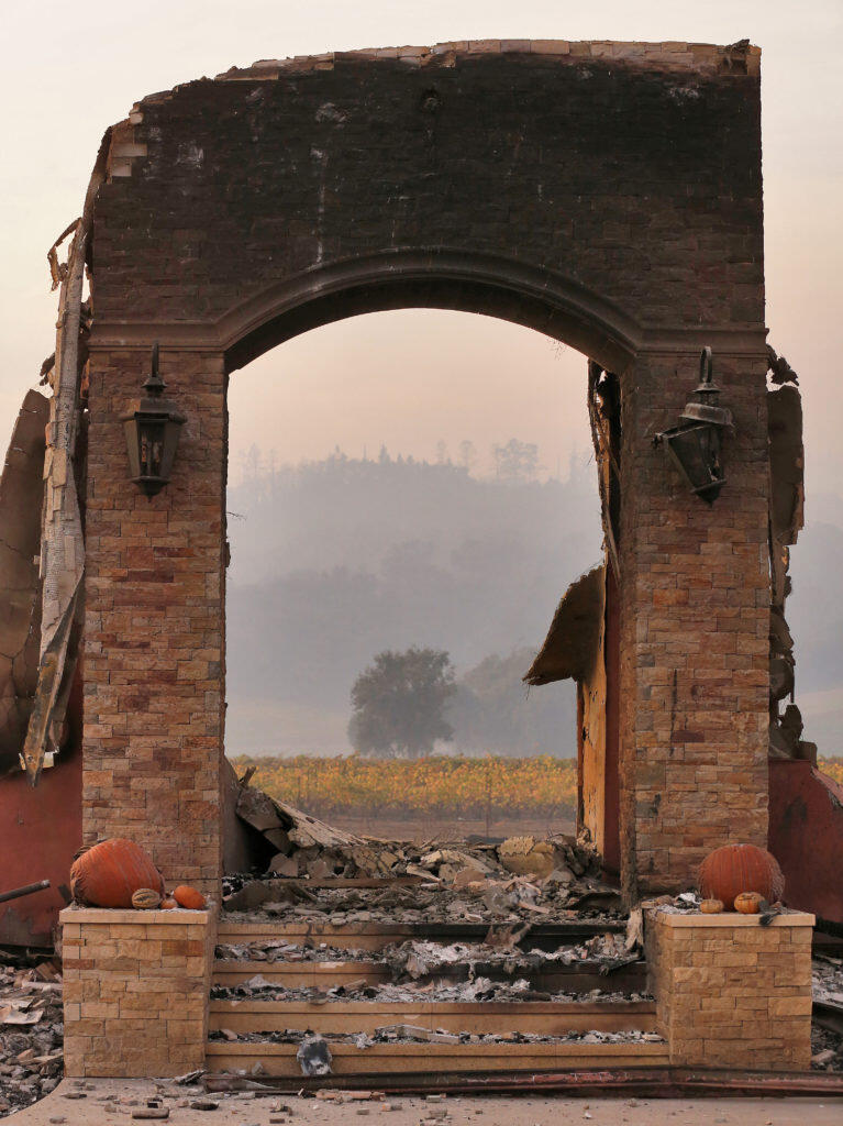 The brick doorway to a home off Geysers Road remains standing after the building burned down in the Kincade fire, in Geyserville, on Oct. 24, 2019. (Alvin Jornada / The Press Democrat)