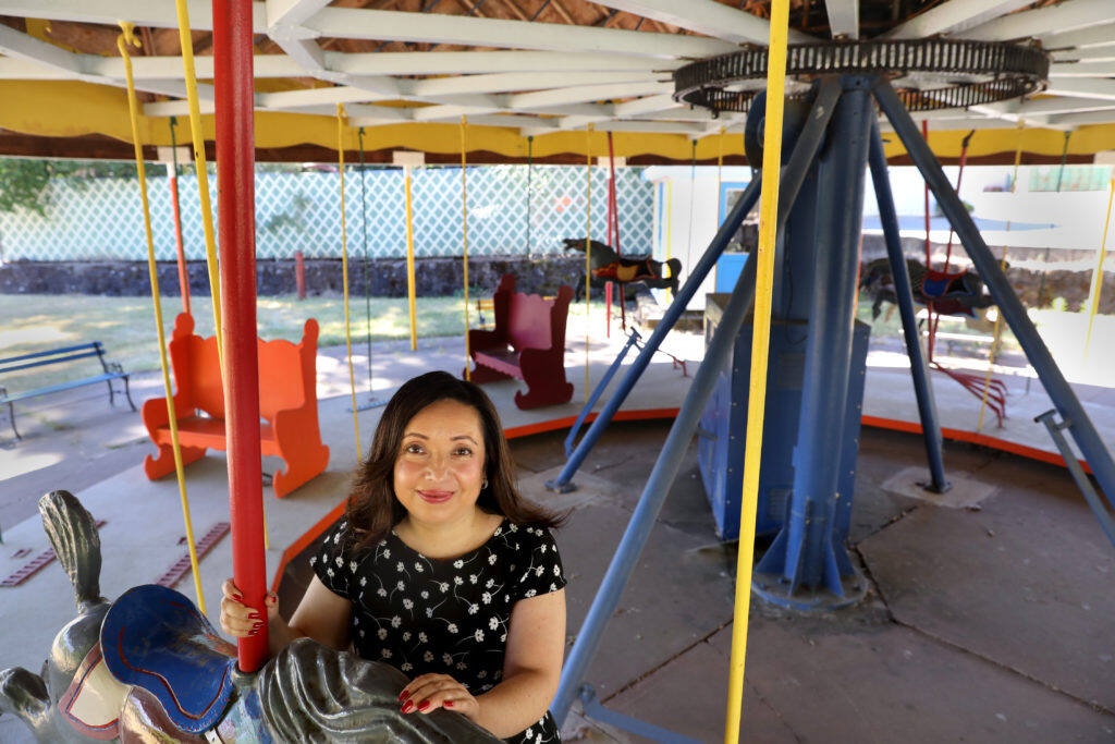 Filmmaker Malinalli Lopez Arreguin, on the carousel at the now closed Sonoma Developmental Center in Glen Ellen  on Wednesday, July 10, 2019. Her documentary “True Humans” premiers on Aug. 4th at the Sebastiani Theater. (BETH SCHLANKER/ The Press Democrat)