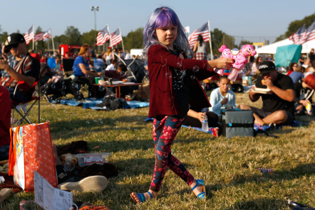 Brielle Schlaepfer, 6, of Santa Rosa tries out her new bubble gun during the Windsor Kaboom! fireworks show and Independence Day celebration at Keiser Park in Windsor, California, on Tuesday, July 3, 2018. (Alvin Jornada / The Press Democrat)
