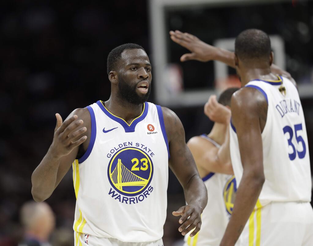 The Golden State Warriors' Draymond Green and Kevin Durant celebrate during the second half of Game 4 of the NBA Finals against the Golden State Warriors, Friday, June 8, 2018, in Cleveland. (AP Photo/Tony Dejak)