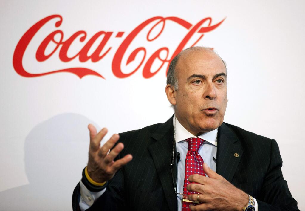 FILE - In this May 8, 2013 file photo, Coca-Cola CEO Muhtar Kent speaks during a news conference in Atlanta. Coca-Cola said Friday, Dec. 9, 2016 that Kent will step down as CEO next year and be replaced by Chief Operating Officer James Quincey. (AP Photo/David Goldman, File)