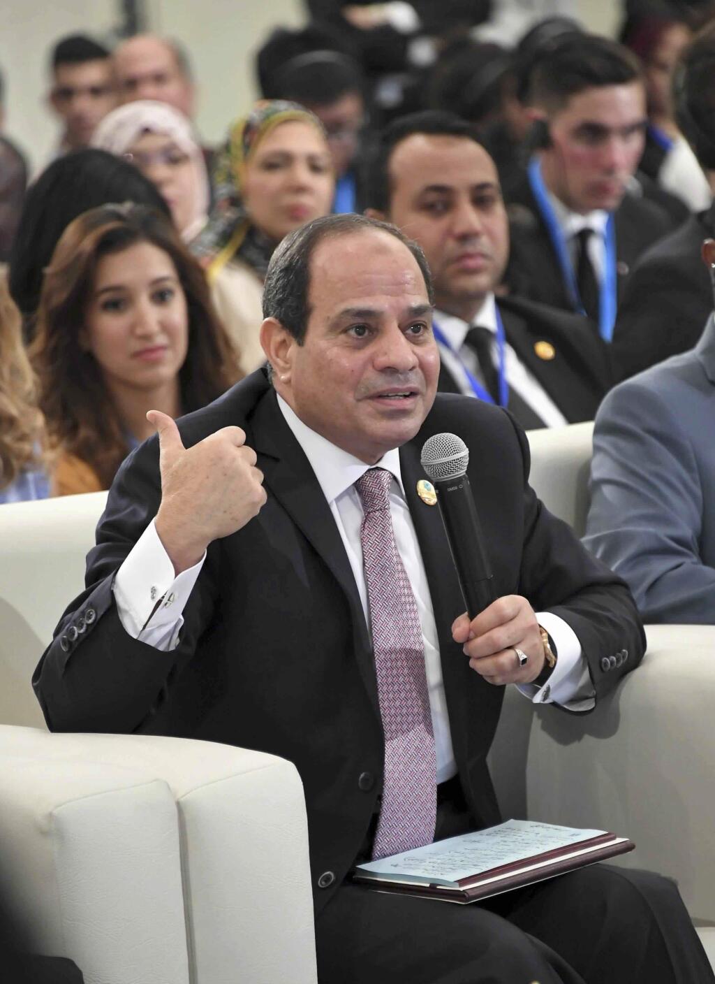 FILE- In this undated file photo provided by Egypt's state news agency, MENA, Egyptian President Abdel-Fattah el-Sissi participates in a panel discussion entitled, ' The role of women in decision making,' at the 'World Youth Forum,' a government-organized event, in the Red Sea resort of Sharm el-Sheikh, Egypt. el-Sissi said Wednesday Nov. 8, 2017, that Iran must stop 'meddling' in the region's affairs and asking for dialogue so that the security of Arab Gulf countries is not be threatened. (MENA file via AP)
