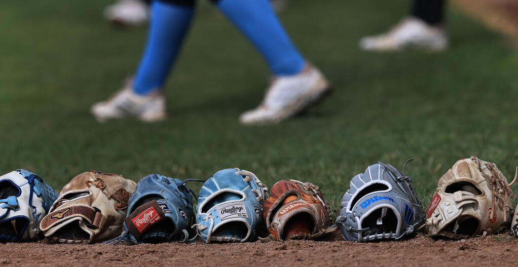 Softball gloves, Tuesday, May 2, 2023 during Sonoma State University’s women’s softball practice in Rohnert Park. (Kent Porter / The Press Democrat) 2023