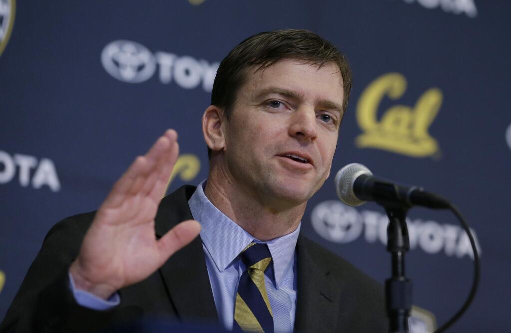 In this Jan. 17, 2017, file photo, new Cal head football coach Justin Wilcox waves at the end of an introductory news conference in Berkeley. Wilcox will make his coaching debut on Saturday at North Carolina. (AP Photo/Eric Risberg, File)