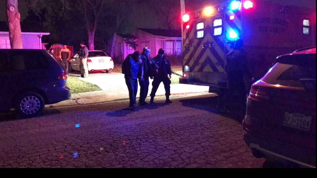 Medics and officers escort a man as he walks to an ambulance in Corpus Christi, Texas. A man believed to be in his 30s is in police custody after four people were stabbed Wednesday, Feb. , 7, 2018 evening during a church service inside a residence in Corpus Christi. (Alexandria Rodriguez/Corpus Christi Caller-Times via AP)