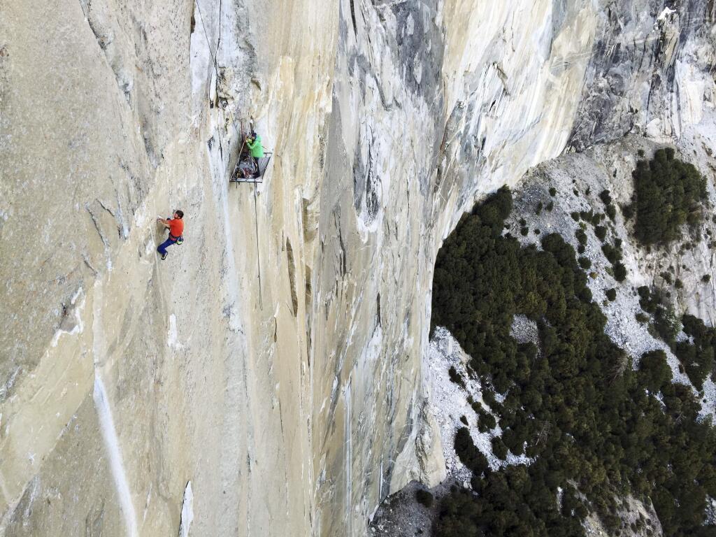 In a handout photo, Tommy Caldwell, left, and Kevin Jorgeson climbing the Dawn Wall on El Capitan in Yosemite National Park, Jan. 1, 2015. The two climbers are attempting to climb more than half a mile up a section known as Dawn Wall without the benefit of ropes, a feat they have sought for several years with single-minded obsession. (Brett Lowell/Big UP Productions via The New York Times)