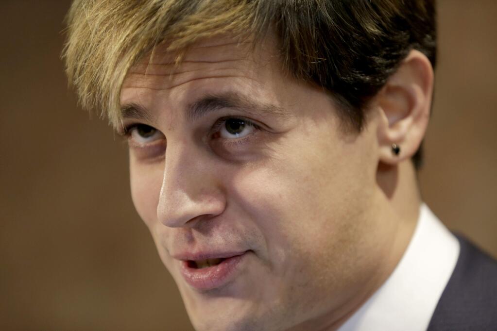 CORRECTS TO OMIT ANN COULTER- FILE - In this Feb. 21, 2017 file photo, Milo Yiannopoulos speaks during a news conference in New York. Right-wing showman Milo Yiannopoulos is holding a 'Free Speech Week' at the University of California, Berkeley with a planned lineup including conservative firebrands Steve Bannon. The university says it has no confirmation the headline acts will appear but is preparing strong security to head off any more violent protests at the liberal campus. (AP Photo/Seth Wenig, File)