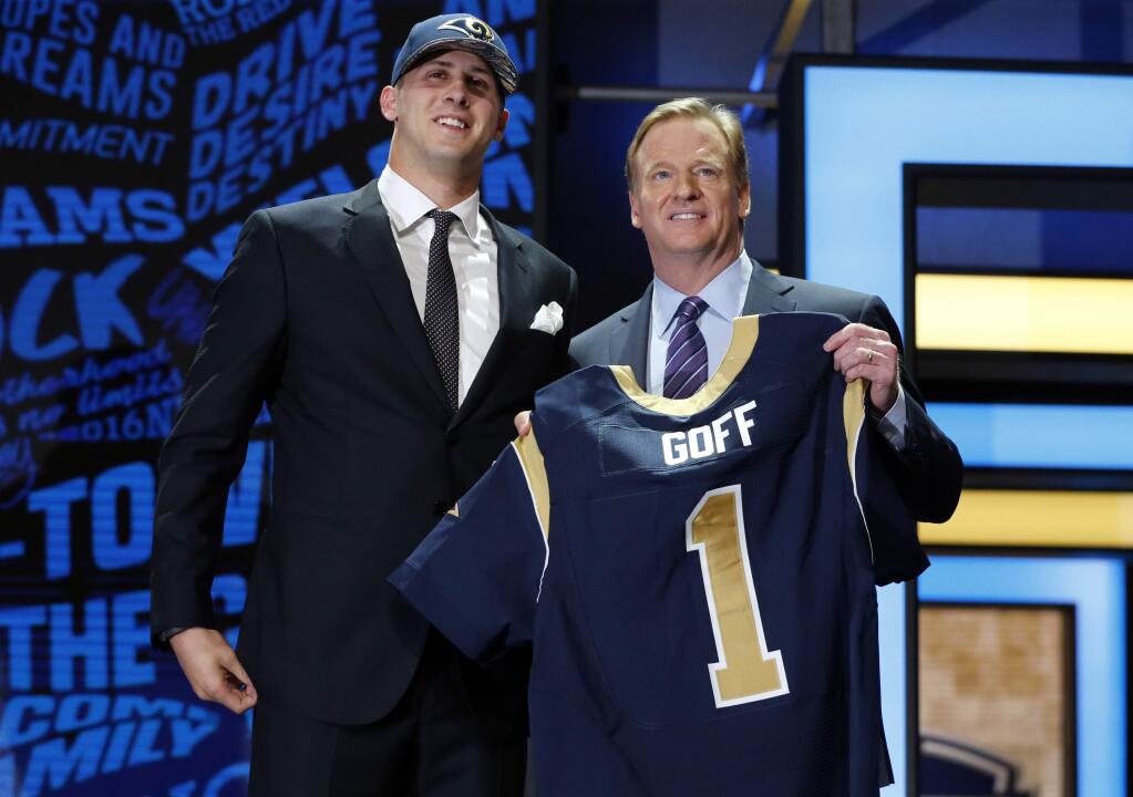 Californias Jared Goff poses for photos with NFL commissioner Roger Goodell after being selected by the Los Angeles Rams as the first pick in the first round of the 2016 NFL football draft, Thursday, April 28, 2016, in Chicago. (AP Photo/Charles Rex Arbogast)
