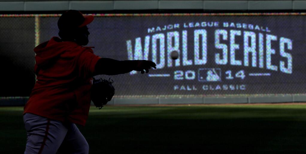 San Francisco Giants third baseman Pablo Sandoval throws to second during baseball practice Monday, Oct. 20, 2014, in Kansas City, Mo. The Kansas City Royals will host the Giants in Game 1 of the World Series on Oct. 21. (AP Photo/David J. Phillip)