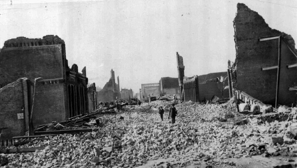 In this undated file photograph, people walk through the rubble following the April 18, 1906 earthquake in San Francisco. The quake lasted for less than a minute, but the fires burned for three days, roaring across 430 blocks in what was then the 10th largest city in the United States. The San Francisco Chronicle reported Saturday, March 4, 2018, that a long-lost film reel with nine minutes of footage capturing San Francisco two weeks after the deadly 1906 earthquake surfaced at a flea market in the city. The rare find portrays the city's post-quake devastation. (San Francisco Chronicle via AP)
