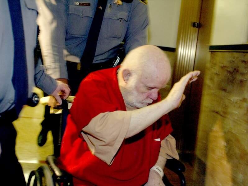 **FILE** Kenneth Parnell, 72, tries to block his face from cameras in this file photo from Feb. 9, 2004, in Oakland, Calif. Parnell, one of California's most notorious child molesters, has died of natural causes while serving a life sentence. Parnell, 76, died at the California Medical Facility in Vacaville on Monday, Jan. 21, 2008, corrections officials said. (AP Photo/The Oakland Tribune, Nick Lammers) **NO SALES MAGS OUT MANDATORY CREDIT**