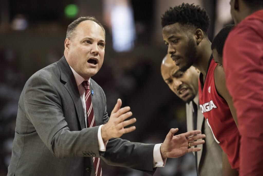 In this Saturday, Feb. 4, 2017 file photo, Georgia head coach Mark Fox communicates with players during the first half against South Carolina in Columbia, S.C. (AP Photo/Sean Rayford, File)