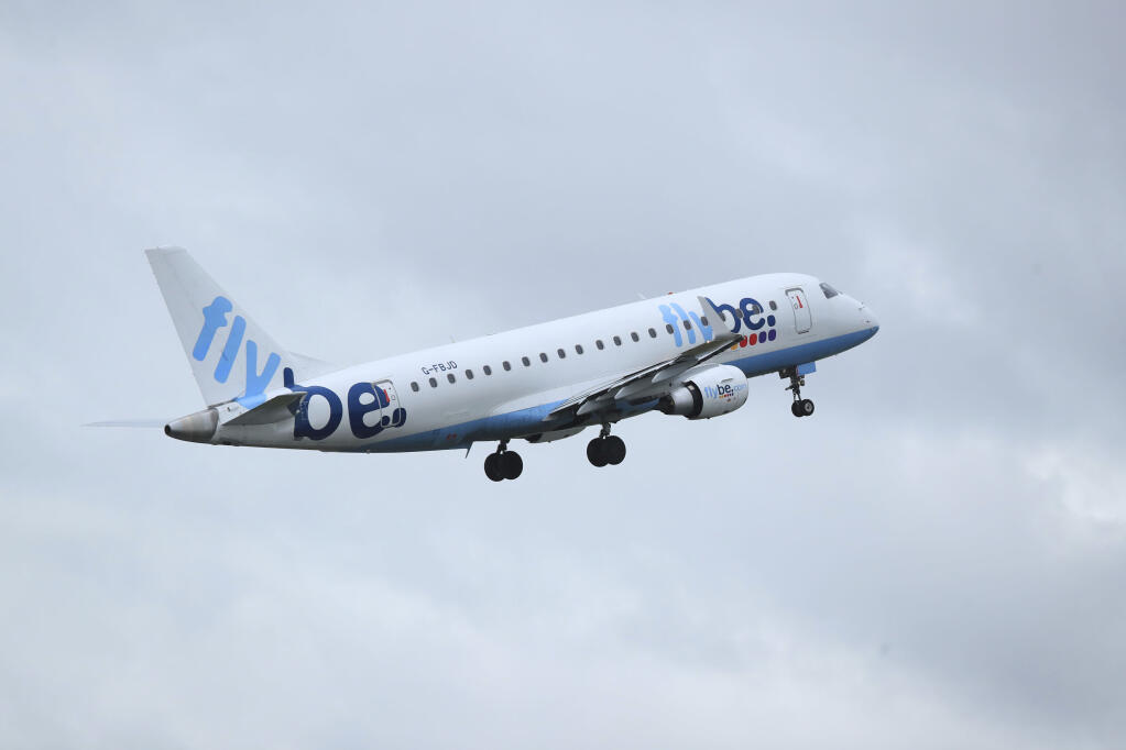 FILE  - A view of a Flybe flight departing from Manchester Airport, Manchester, England, Jan. 13, 2020. Struggling U.K. airline Flybe has collapsed for the second time in less than three year it was announced on Saturday, Jan. 28, 2023. The flyer initially limped into bankruptcy in March 2020, with the loss of 2,400 jobs. It was relaunched in April 2022 with hedge fund backing, but has called in the bankruptcy accountants once again after less than 12 months back in the air. (Peter Byrne/PA via AP, File)