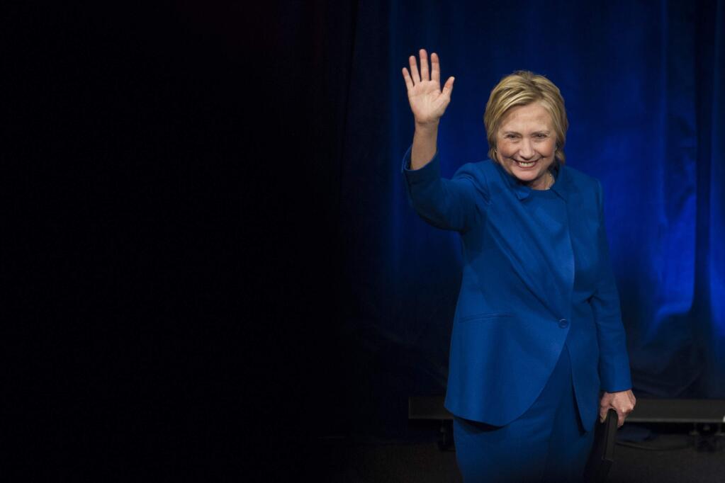 Hillary Clinton waves to the audience after addressing Children's Defense Fund's Beat the Odds celebration at the Newseum in Washington, Wednesday, Nov. 16, 2016. (AP Photo/Cliff Owen)