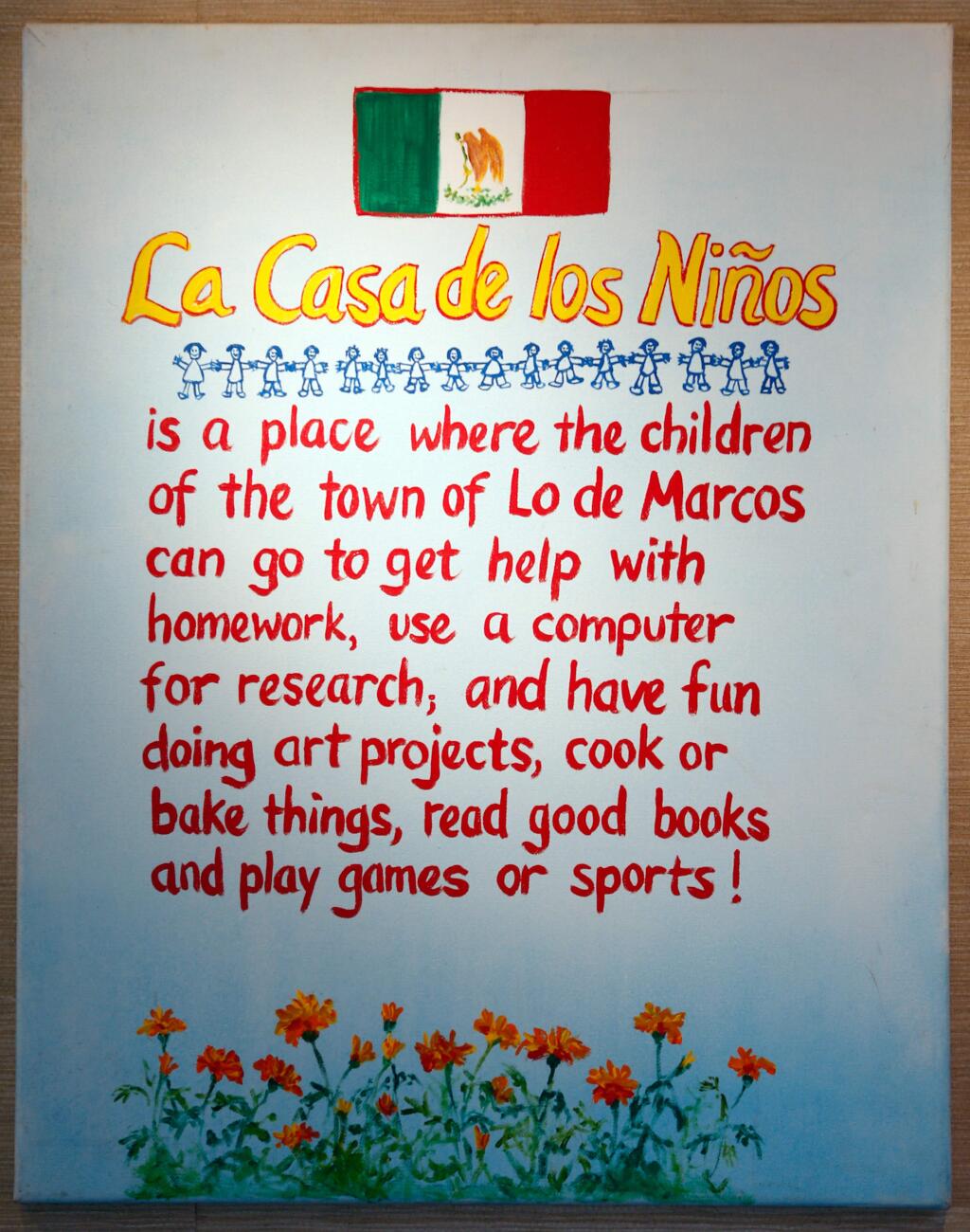 A painting about La Casa de los Niños, a nonprofit organization founded by Patricia and David Martinez and their friends Dulce and Jim Heinrich, which provides tutoring and activities for children of Lo de Marcos, Mexico, is displayed at the Martinez home. (Alvin Jornada / The Press Democrat)