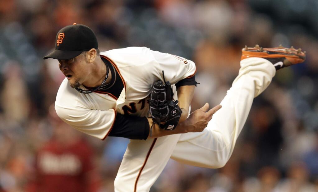 San Francisco Giants' Ryan Vogelsong follows through on a pitch to the Arizona Diamondbacks in the first inning of a baseball game Wednesday, Sept. 10, 2014, in San Francisco. (AP Photo/Ben Margot)