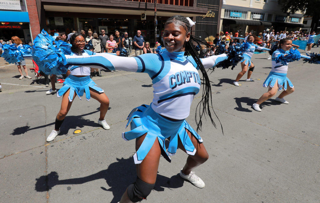 The Compton High School band and cheerleader made the long trek north to participate in the 2018 Santa Rosa Rose Parade on Saturday.  (photo by John Burgess/The Press Democrat)