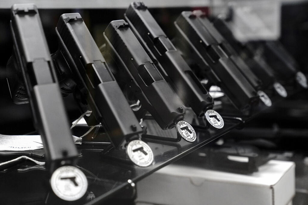 Glock semi-automatic pistols for sale at a gun store in Oceanside on April 12, 2021. Photo by Bing Guan, Reuters