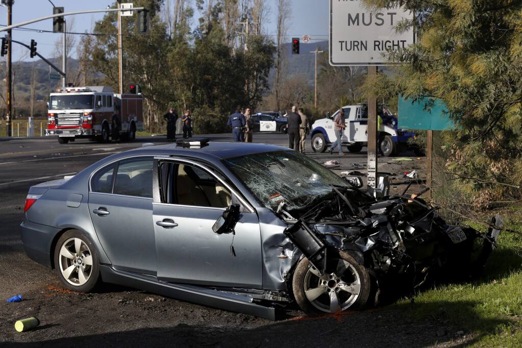 Emergency workers respond to the scene of a fatal accident after an alleged drunk driver of a BMW ran a red light killing the 35-year-old male driver of a Subaru and seriously injuring passenger 34-year-old Natalie Weiss at 8th Street and East Napa Rd. in Sonoma on Sunday, January 26, 2020. (BETH SCHLANKER/ The Press Democrat)
