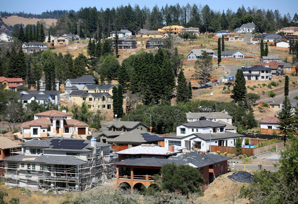 Homes in various stages of construction in Fountaingrove, Wednesday, June 24, 2020, an area devastated by the 2017 Tubbs Fire.  (Kent Porter / The Press Democrat)