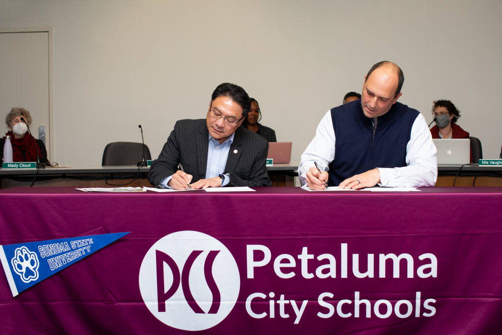 Petaluma City Schools Superintendent Matthew Harris and Sonoma State University President Dr. Mike Lee signed a "Promise" agreement at a board meeting on Tuesday, December 13, 2022. The agreement guarantees qualifying students in PCS admission to the university. (COURTESY OF MELISSA MORELLI)